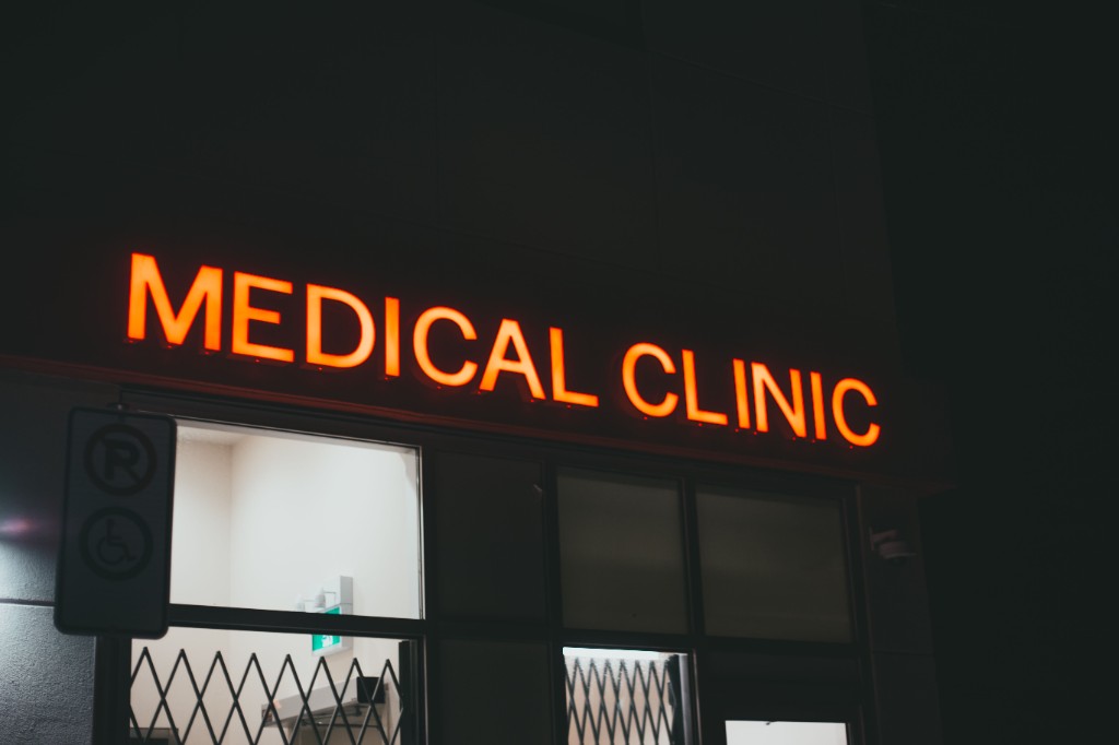 Medical clinic exterior sign at night